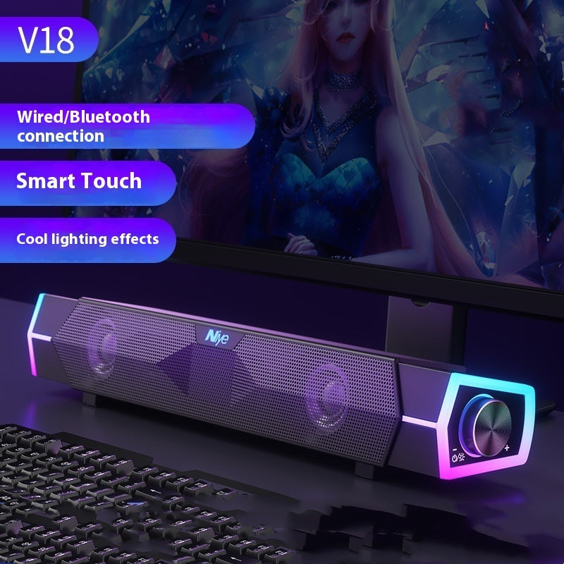 Gaming monitor with soundbar and keyboard, featuring text on connection methods and effects.