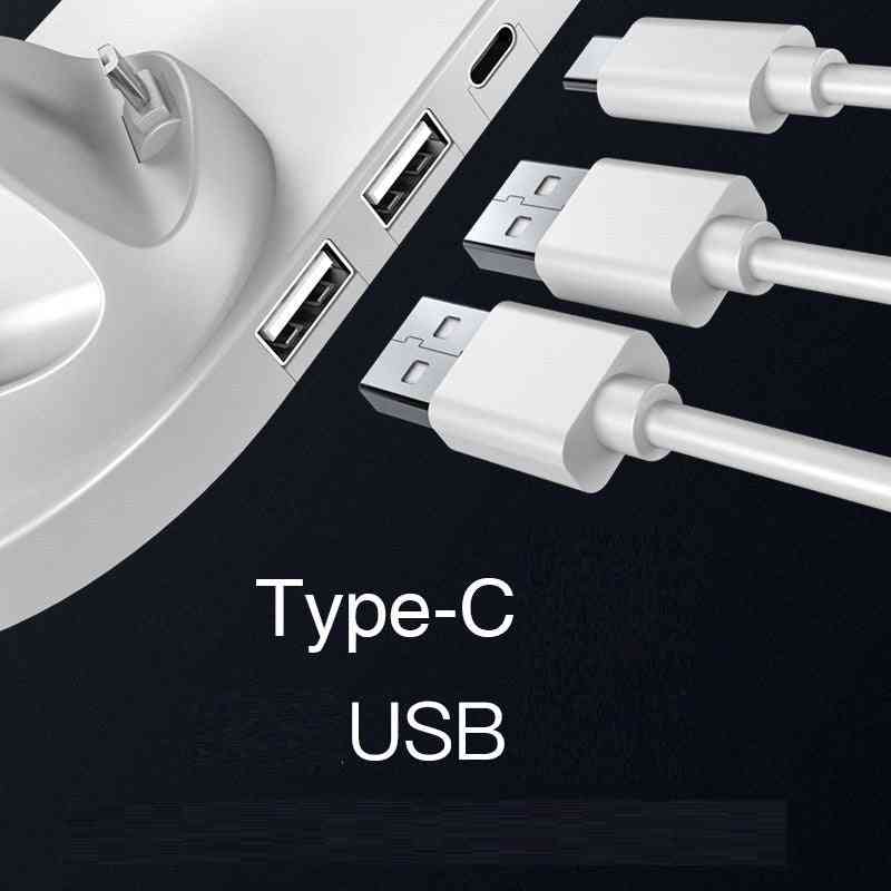 Multiple USB cables connected to a device with USB ports on a black background.