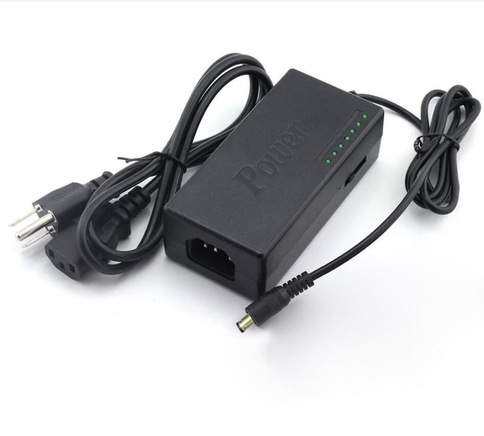 Black power adapter with multiple connectors on a white background