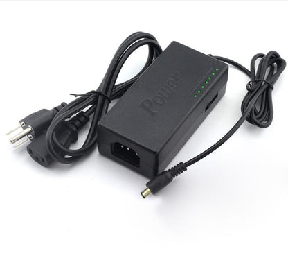 Black power adapter with multiple connectors on a white background