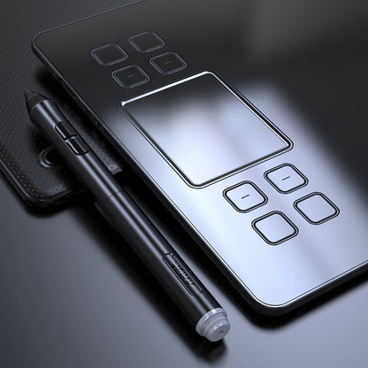 Graphic tablet with stylus on a dark surface