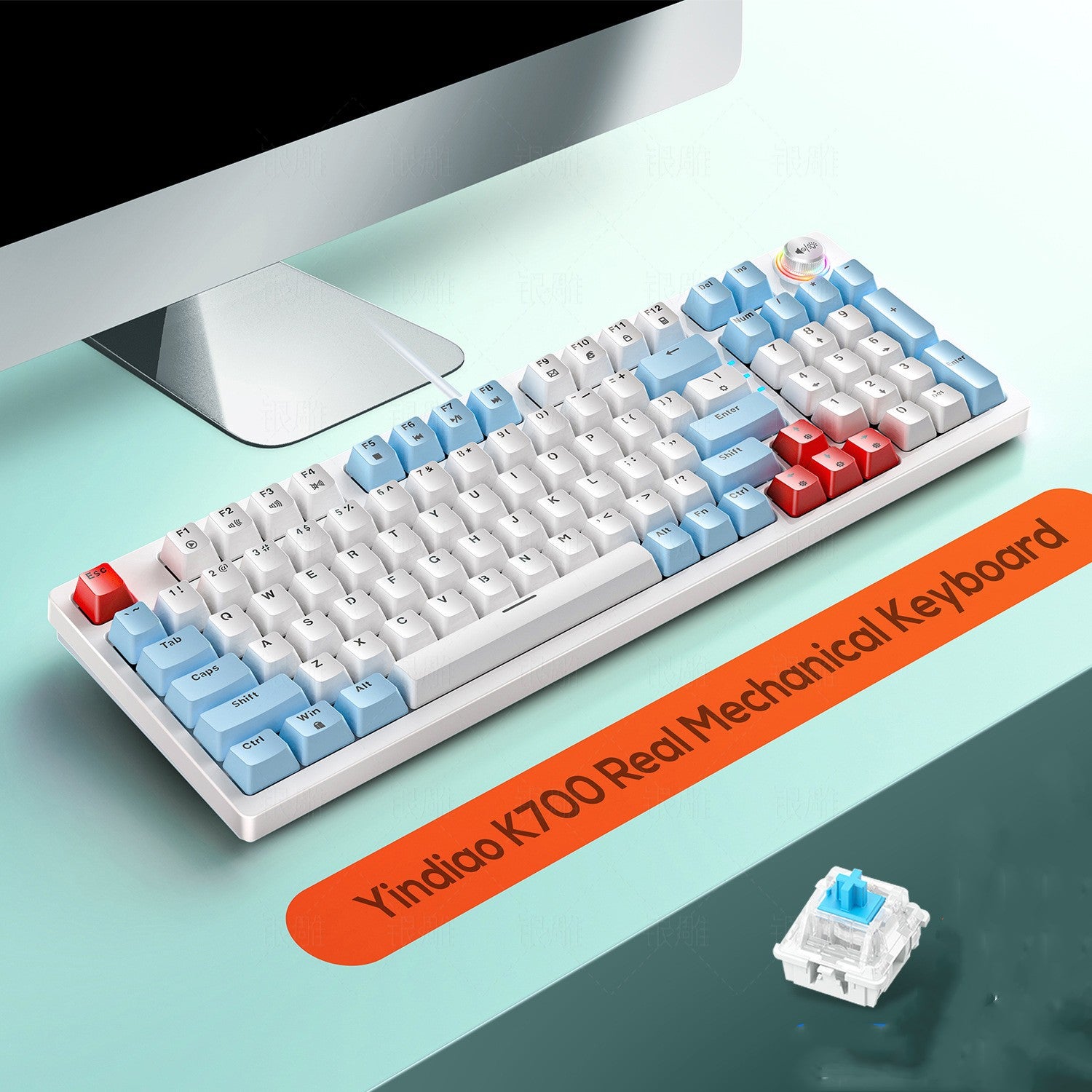 Mechanical keyboard with blue and white keys on a desk, featuring the brand 'Yindao K700'.