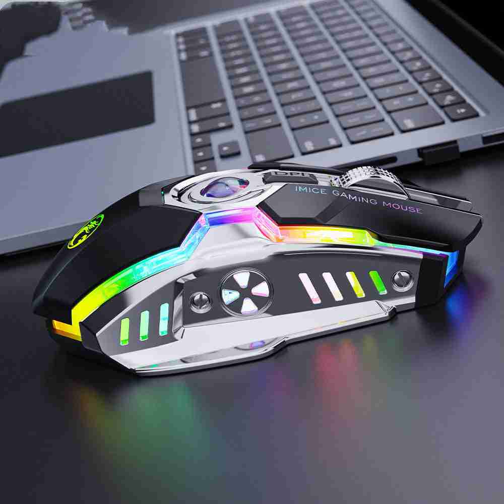 Gaming mouse with RGB lighting on a desk in front of a laptop