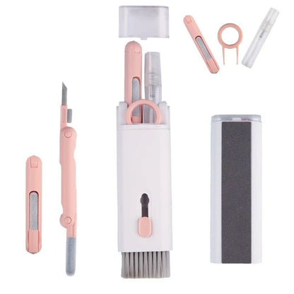 Set of pink and white skincare tools including a knife, comb, and other small instruments on a white background.