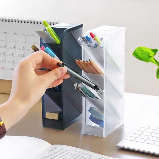 Desk organizer with stationery items on a desk next to a laptop