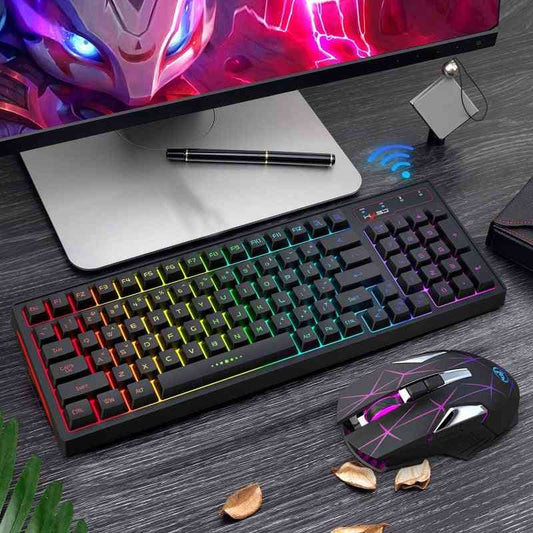 Gaming keyboard and mouse set on a desk with a monitor in the background