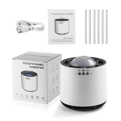 White dynamic humidifier with packaging, USB cable, and replacement filters on a white background