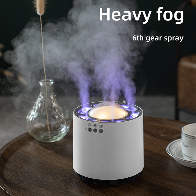 Humidifier emitting heavy fog on a wooden table with decorative elements.