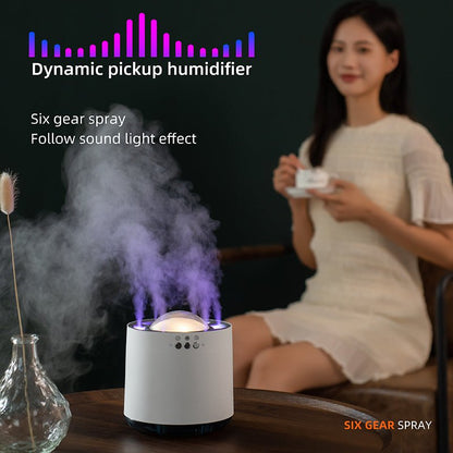 Humidifier with sound light effect on a table, woman holding a cup in the background