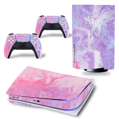 Gaming console and controllers with pink and purple marble design on a white background