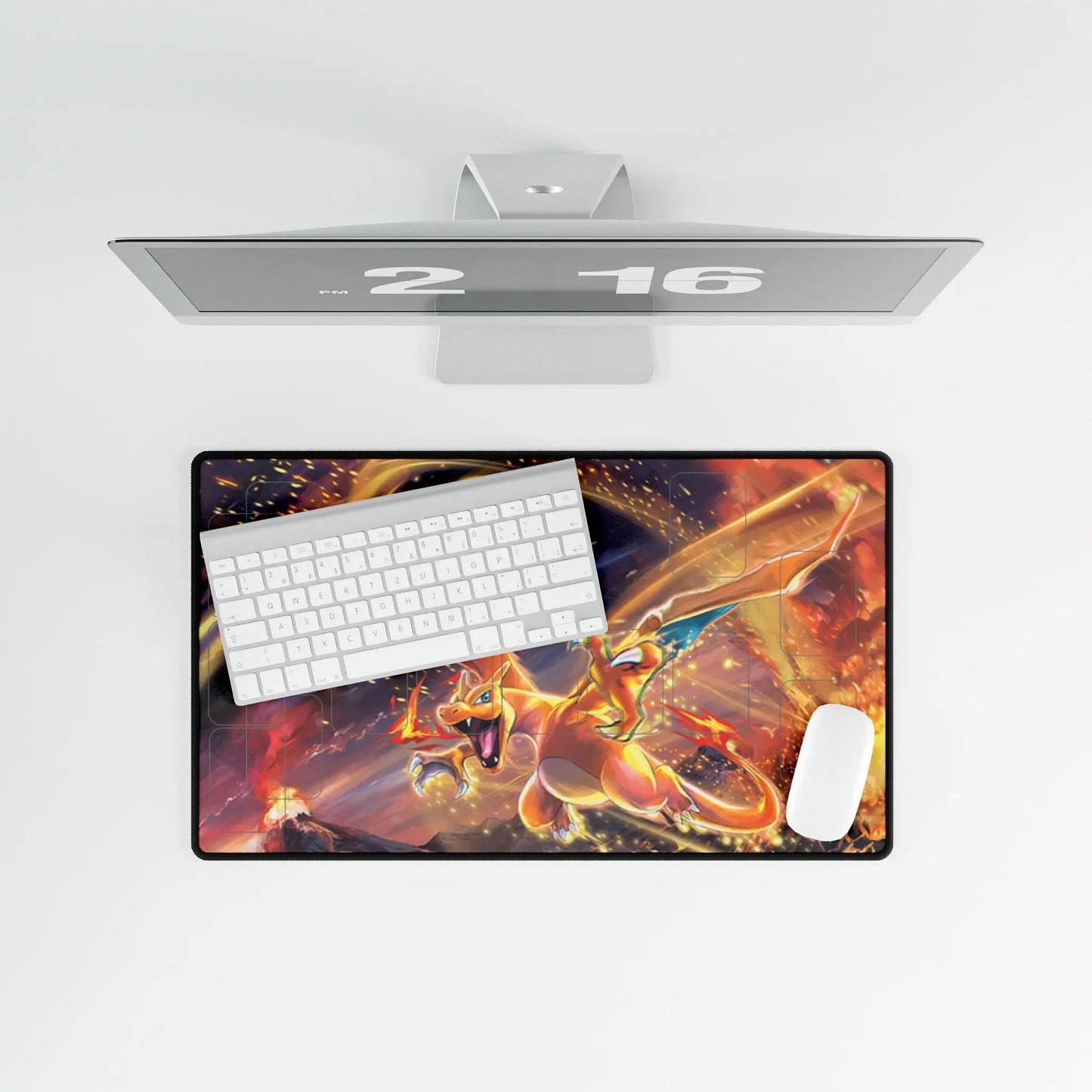 Gaming desk setup with a monitor, keyboard, mouse, and large mouse pad featuring a dragon design.