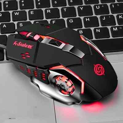 G-Snake gaming mouse with red accents on a laptop keyboard