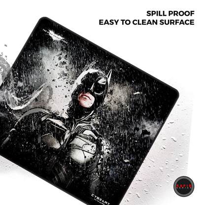 Batman-themed mouse pad with 'Spill Proof' and 'Easy to Clean Surface' text on a white background.