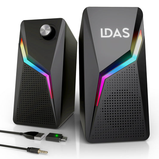 Black computer speakers with RGB lighting and USB cable on a white background