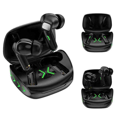 Black wireless earbuds with green accents in open and closed cases on a white background