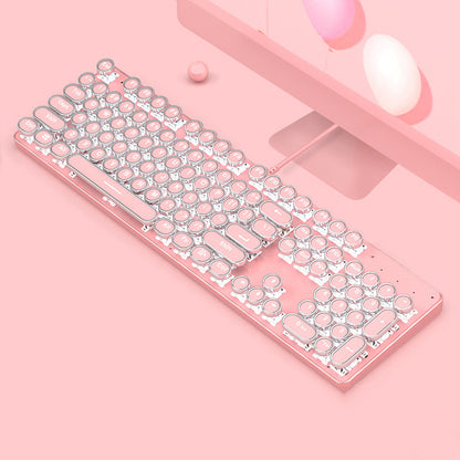 Pink and silver keyboard on a pink background
