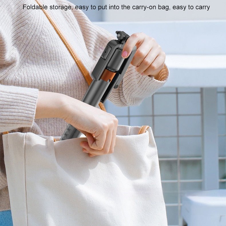 Person holding a folded portable device, likely a travel-sized vacuum cleaner, over a tote bag with text about foldable storage.