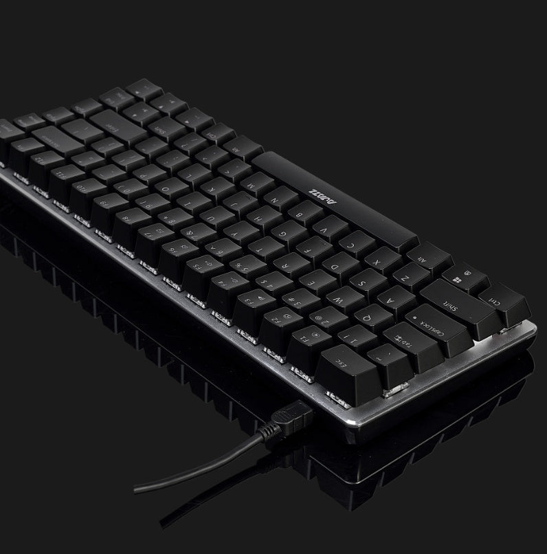 Black mechanical keyboard on a reflective surface with a dark background