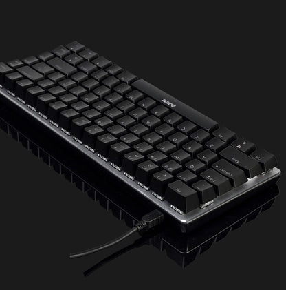 Black mechanical keyboard on a reflective surface with a dark background