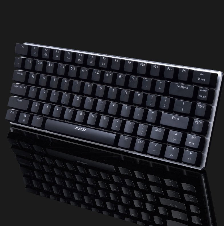 Black keyboard with visible brand logo on a reflective black surface