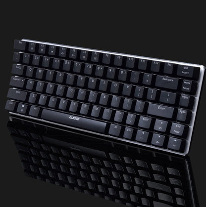 Black keyboard with visible brand logo on a reflective black surface