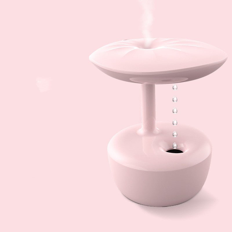 Pink ceramic planter with a small pot inside on a pink background