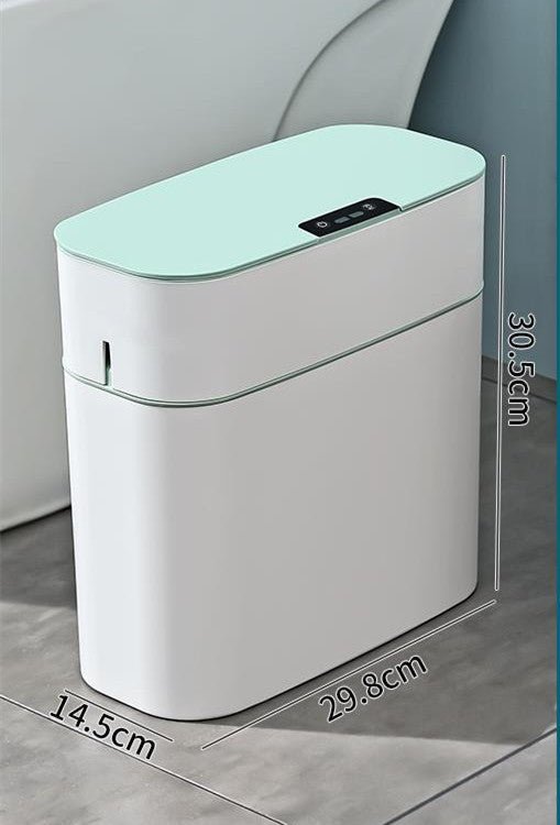 White electronic device with a green top on a gray surface, showing dimensions.