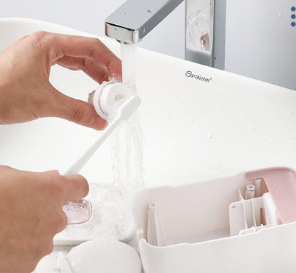 Person washing a toothbrush under running water with a faucet labeled 'Opalaim' in the background.