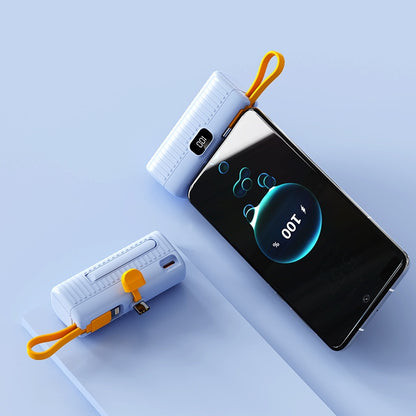 Two white power banks with orange straps on a smartphone displaying 'OUT' on a light blue background