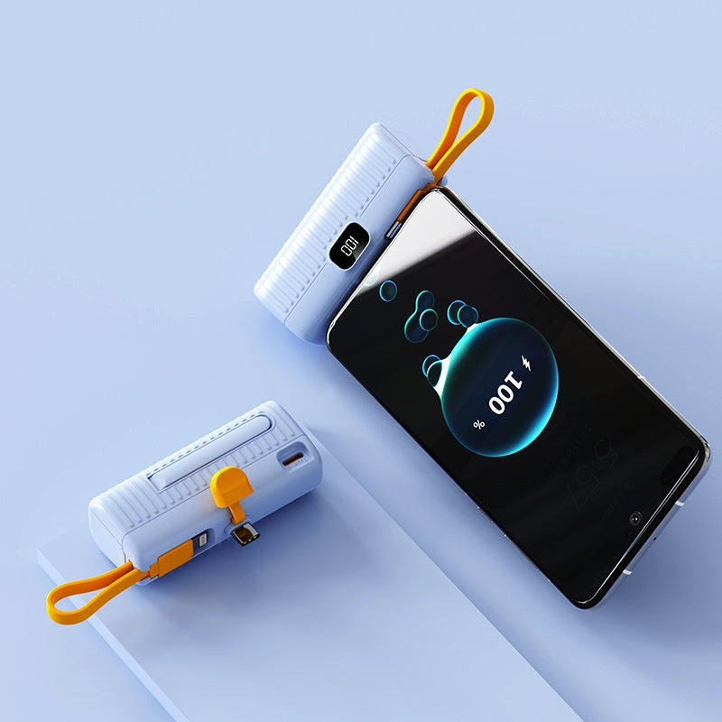 Two white power banks with orange straps on a smartphone displaying 'OUT' on a light blue background