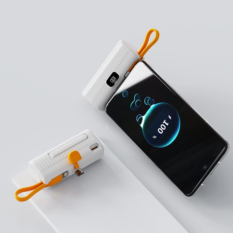 Phone with power bank on a light gray background
