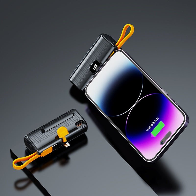 Black power bank with yellow strap on a dark gray background