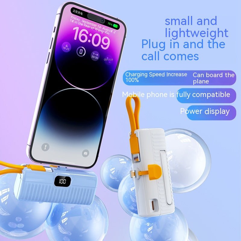 Phone with power bank and charger on a light blue background