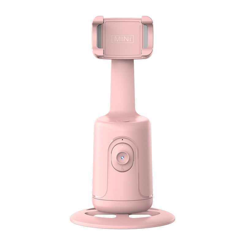 Pink handheld device with a stand on a white background