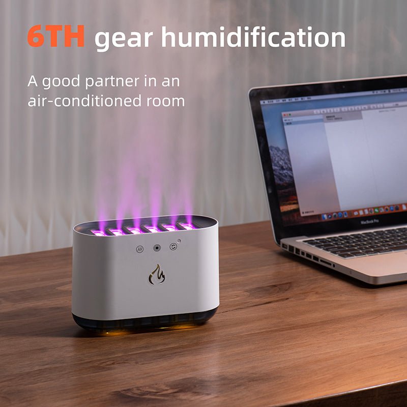 Humidifier on a desk next to a laptop with '6TH gear humidification' text.