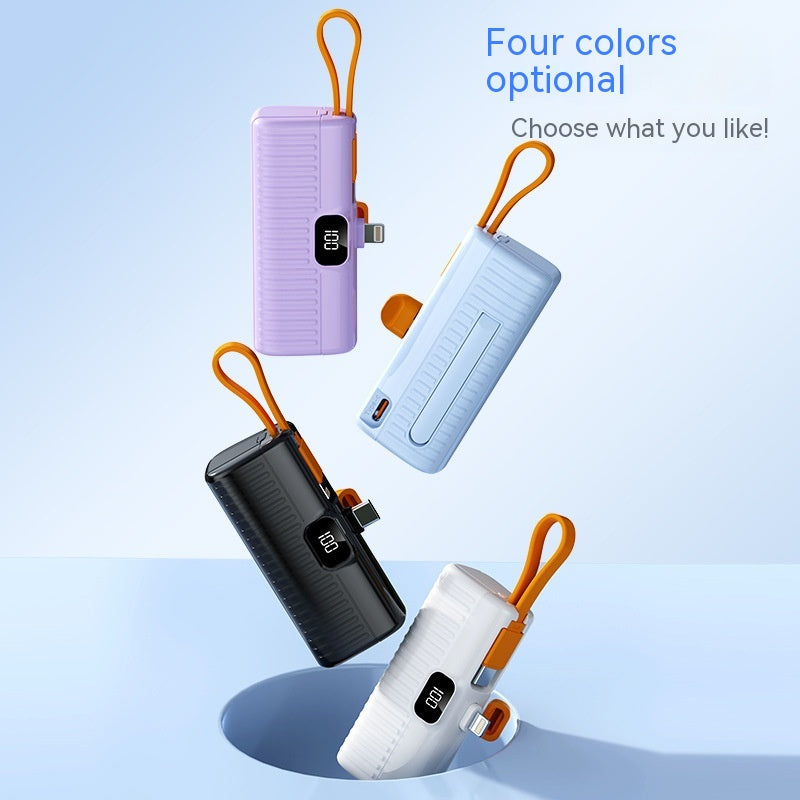 Four portable power banks in different colors on a light blue background