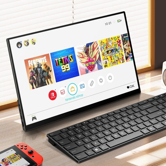 Tablet with gaming interface on a desk with keyboard and Switch controller