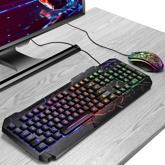 Gaming keyboard and mouse set on a desk with a monitor in the background