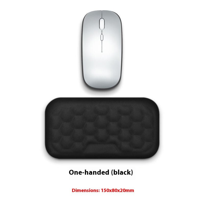 Silver computer mouse and black mouse pad on a white background