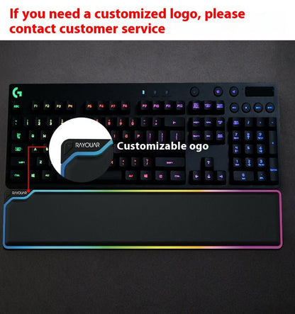 Gaming keyboard with customizable logo on a dark background
