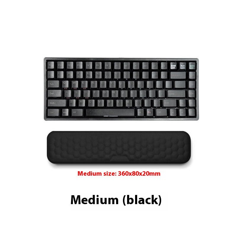 Black keyboard and wrist rest on a white background