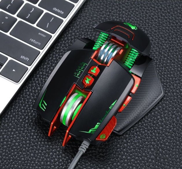 Gaming mouse with red and green accents on a textured surface next to a keyboard