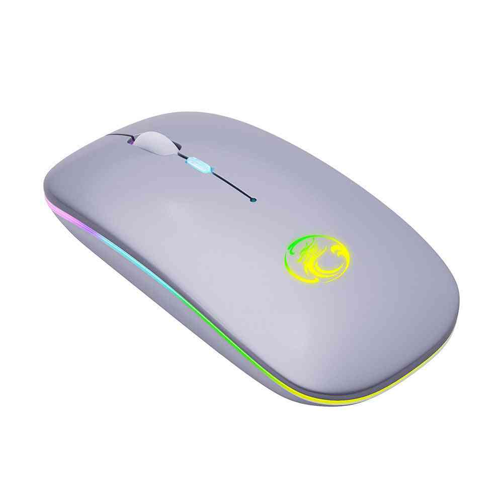 Gray computer mouse with colorful LED lighting on a white background
