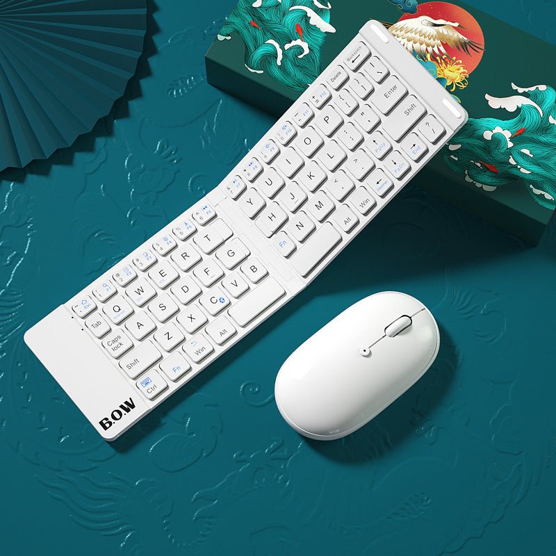 White keyboard and mouse set on a decorative blue background with traditional elements.