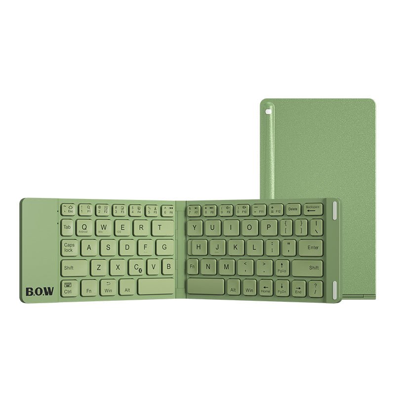Green keyboard and tablet on a white background