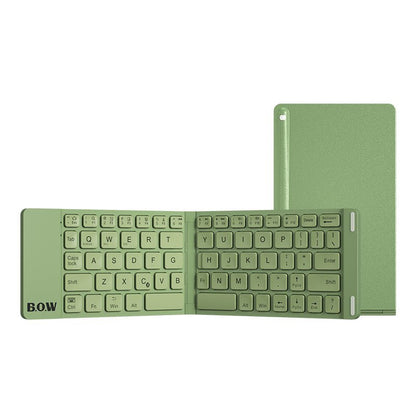 Green keyboard and tablet on a white background