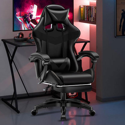 Black gaming chair in a room with a desk and computer setup.