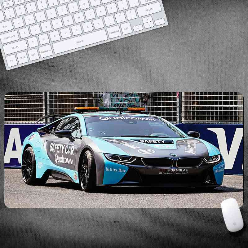 BMW safety car with Qualcomm branding on a desk setup