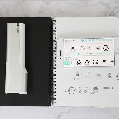Notebook with a smartphone displaying app icons on a marble surface