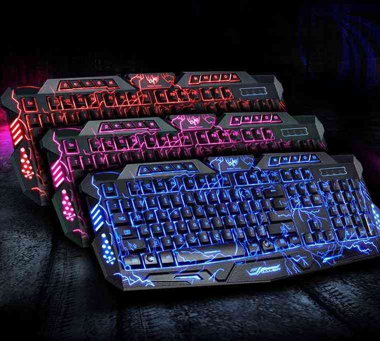 Gaming keyboards with colorful backlighting on a dark surface
